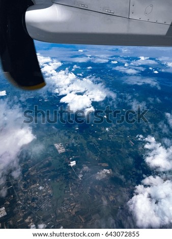 View outside of airplane window and ground