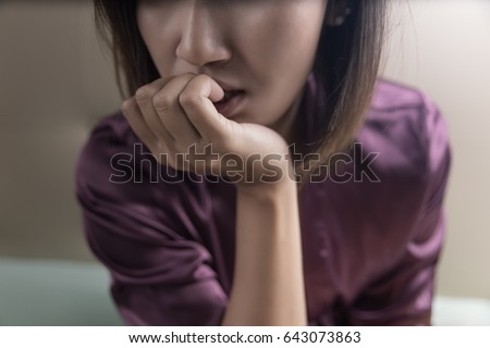 Sad woman in the room. Depression and anxiety disorder concept Royalty-Free Stock Photo #643073863