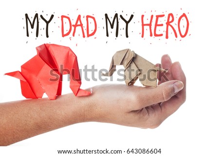 Fathers day message made of origami elephants on arm over white background. Creative quotes. My dad my hero