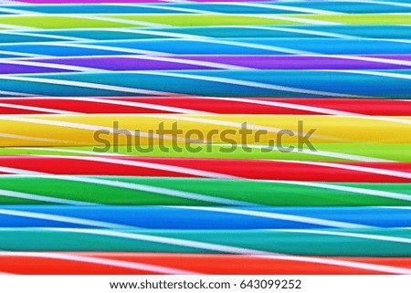 Fancy straw art background. Abstract wallpaper of colored fancy straws. Rainbow colored colorful pattern texture.
Party accessories.