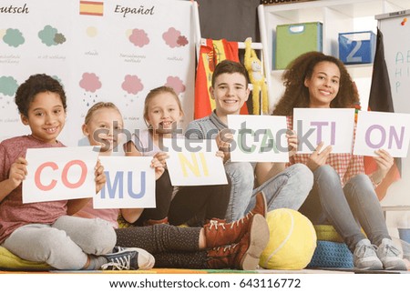 Woman and smiling kids holding communication inscription together/Kids holding communication inscription together/Sunny, partly cloudy, cloudy, rainy, snowy, sleeting, icy, tornado, thumder
