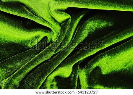 Velvet dress material cloth texture pattern. 
tailoring stitching concept. Shiny beautiful fashion fabric. Shiny clothing material sample.Creased fabric.
