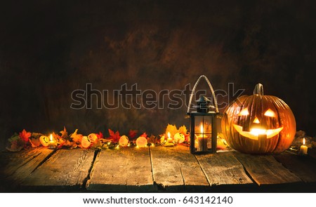 Halloween pumpkin head jack lantern on wooden board