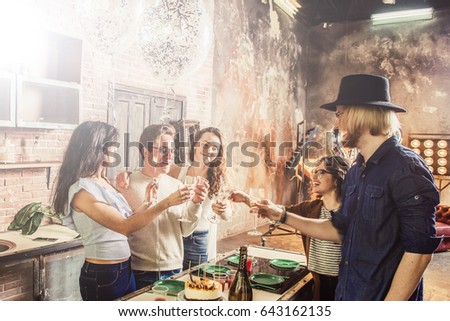 Group of young friends celebrate  a birthday on an open space,flare used to increase the mood and tones of composition