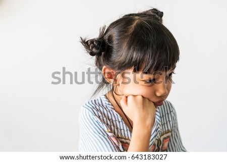 unhappy little children girl  with hand on chin