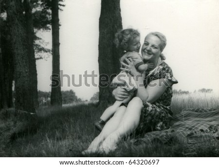 Vintage photo of mother with daughter (fifties)