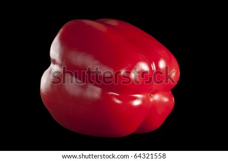 fresh red pepper isolated on black background