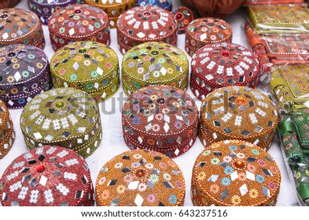 Colourful  Indian Lac Boxes / Traditional Rajasthani Small Jewelry Box decorated with Mirror, Beads, displayed for sale in a street shop Udaipur, Rajasthan India. Royalty-Free Stock Photo #643237516