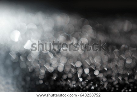 Blurred background with soft bokeh effect over dark space