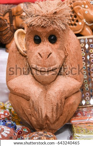 Statue of monkey doll made of dried coconut shell, made from coconut in Kerala stall in market in Delhi India. Displayed for sale. Royalty-Free Stock Photo #643240465