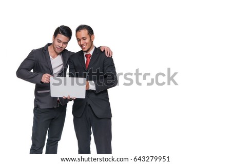 Stock market graphs monitoring concept - two businessmen shaking hands in office  happy blank between them