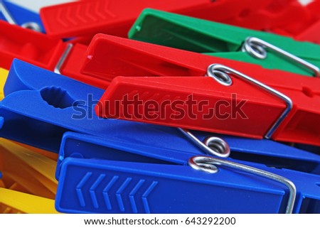 Colorful foracaps tweezers clips as background.