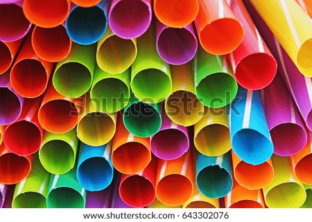 
Fancy straw art background. Abstract wallpaper of colored fancy straws. Rainbow colored colorful pattern texture. Party accessories.