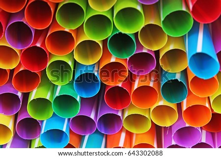 
Fancy straw art background. Abstract wallpaper of colored fancy straws. Rainbow colored colorful pattern texture. Party accessories.