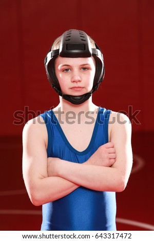 Youth wrestler in blue singlet.
