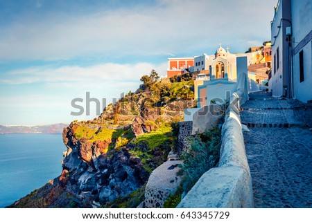 Sunny morning view of Santorini island. Picturesque spring scene of the famous Greek resort Fira, Greece, Europe. Traveling concept background. Artistic style post processed photo.