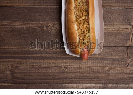 Hot dog on a wooden background, fast food,
eat