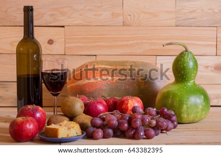 fruits and wine on wooden table, studio picture