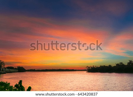 Amazing  sunset on  lake with beautiful colorful lighting twilight time
