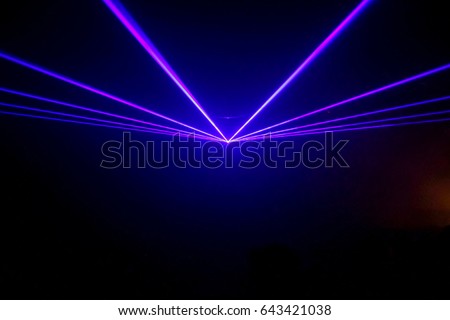 Lights show. Laser show. Night club dj party people enjoy of music dancing sound with colorful light. club night light dj party club. With Smoke Machine and lights.  Royalty-Free Stock Photo #643421038