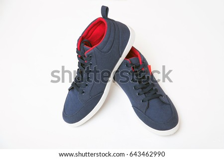Blue sneakers on isolated white background