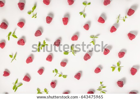 flat lay of trendy seamless pattern with raspberries and mint like background, concept of healthy eating