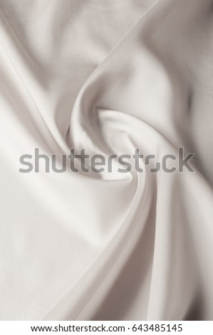Texture background of fabric. White fabric. Silk fabric wallpaper texture background in sepia pastel white shade: Lovely natural silk textured textile White abstract fabric background with soft waves.