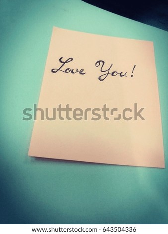 'Love You' word with hand writing on a piece of paper. Picture in retro style
