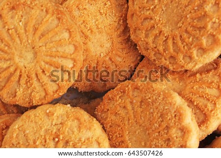 Cookies. Cookie crumpet tea biscuit pattern. Crumpets as background. Biscuits crumpet pattern texture. Sugar coated biscuits.