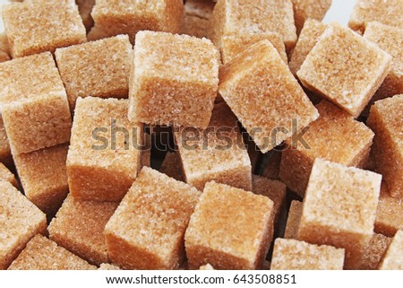 Granulated brown sugar. Lump sugar. Brown sugar cubes. Cane sugar. 