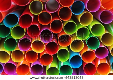 Fancy straw art background. Abstract wallpaper of colored fancy straws. Rainbow colored colorful pattern texture