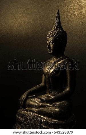 Dark tone Buddha statue, Face of Buddha.Buddha statue face close up, gray-black background