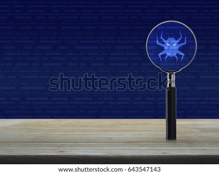 Virus computer icon with magnifying glass on wooden table over binary code background, Business internet security concept