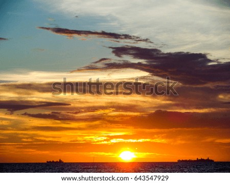 Dark cloud sunset and ship on sea and sky