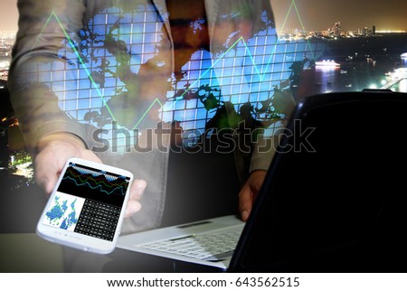 Double exposure of financial graphs, businessman with smartphone