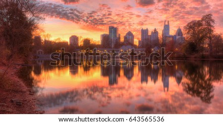 Beautiful panoramic view of Lake Clara Meer, Piedmont Park Aquatic Center and Midtown Atlanta in autumn twilight, USA