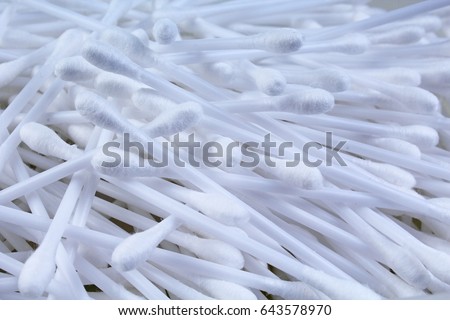 Cotton swab ear cleaning or cosmetic tool as background texture pattern. Cotton swabs.
