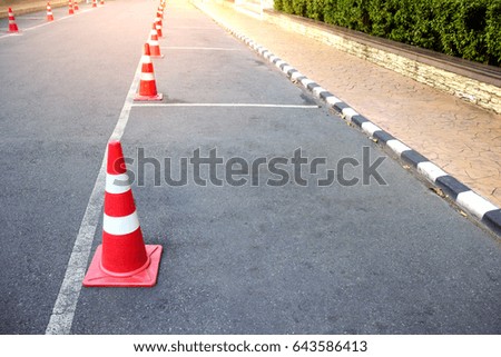 traffic cone with lines parking on asphalt