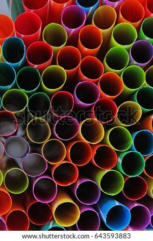 Fancy straw art background. Abstract wallpaper of colored fancy straws. Rainbow colored colorful pattern texture.