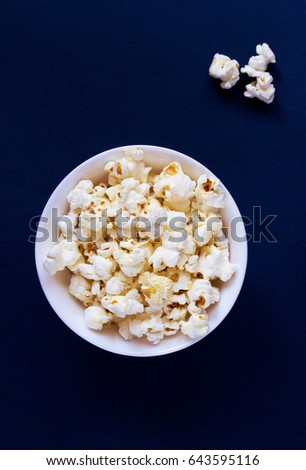 Salty movie theater popcorn in a bowl ready-to-eat.
