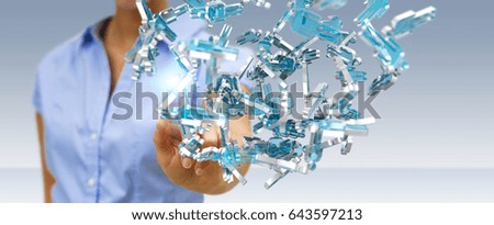Businessman on blurred background holding 3D rendering group of blue people