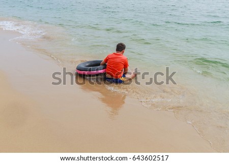 Young man playing beach at the beach