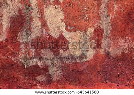 Abstract painted weathered concrete, stone walls damaged by paint. Remains of paint graffiti on weathered plaster of old wall. Abstract graffiti, city culture. Creative background for design