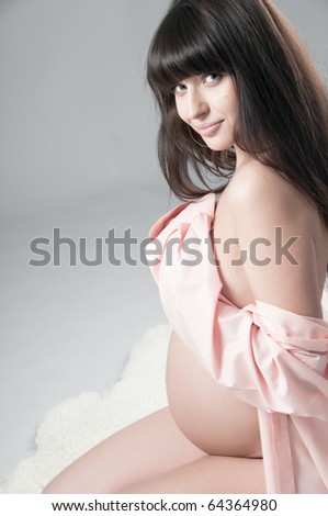 Young pregnant woman in shirt