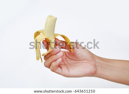Hand holding bite banana on white background