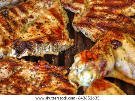 Baking fresh meat on grill closeup
