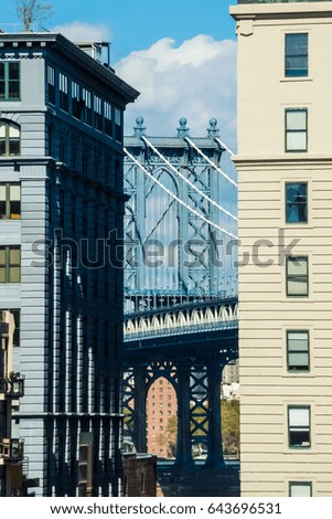 Williamsburg Bridge Manhattan Brooklyn between two houses