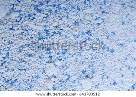 Detergent for a laundry washer. Washing powder texture pattern close up as background.