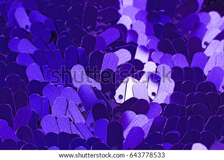 Spangle sequin background. Mirror dress material cloth texture pattern. Tailoring stitching concept. Shiny mirrored fashion fabric. Shiny clothing material sample. Creased fabric. Blue purple sequins.