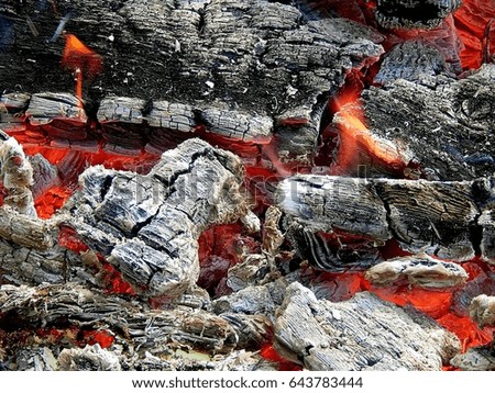 Burning bonfire with red corners close-up